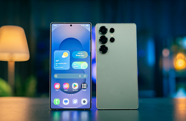 Two Samsung Galaxy S25 phones next to each other. One is facing forward displaying the home screen and the other is facing back.