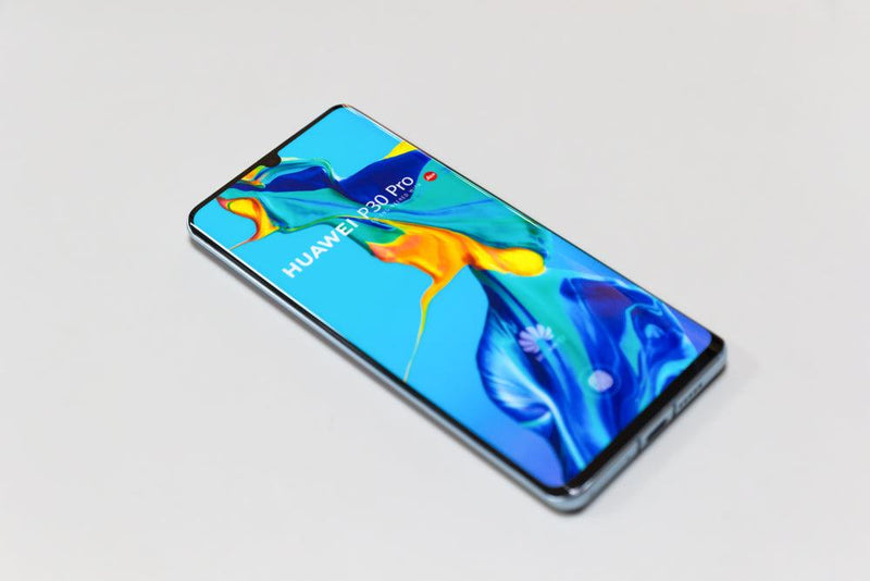 Huawei Phone with Blue and Yellow Screen Saver